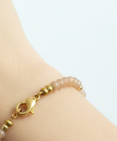 Bracelet perles précieuse pêche/nude