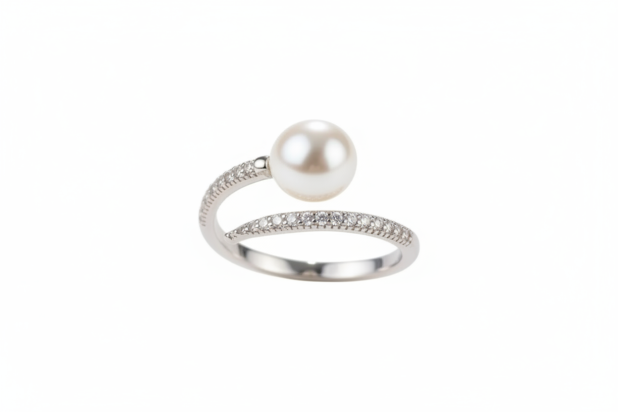 Bague perle et diamants sur fond blanc sans texte