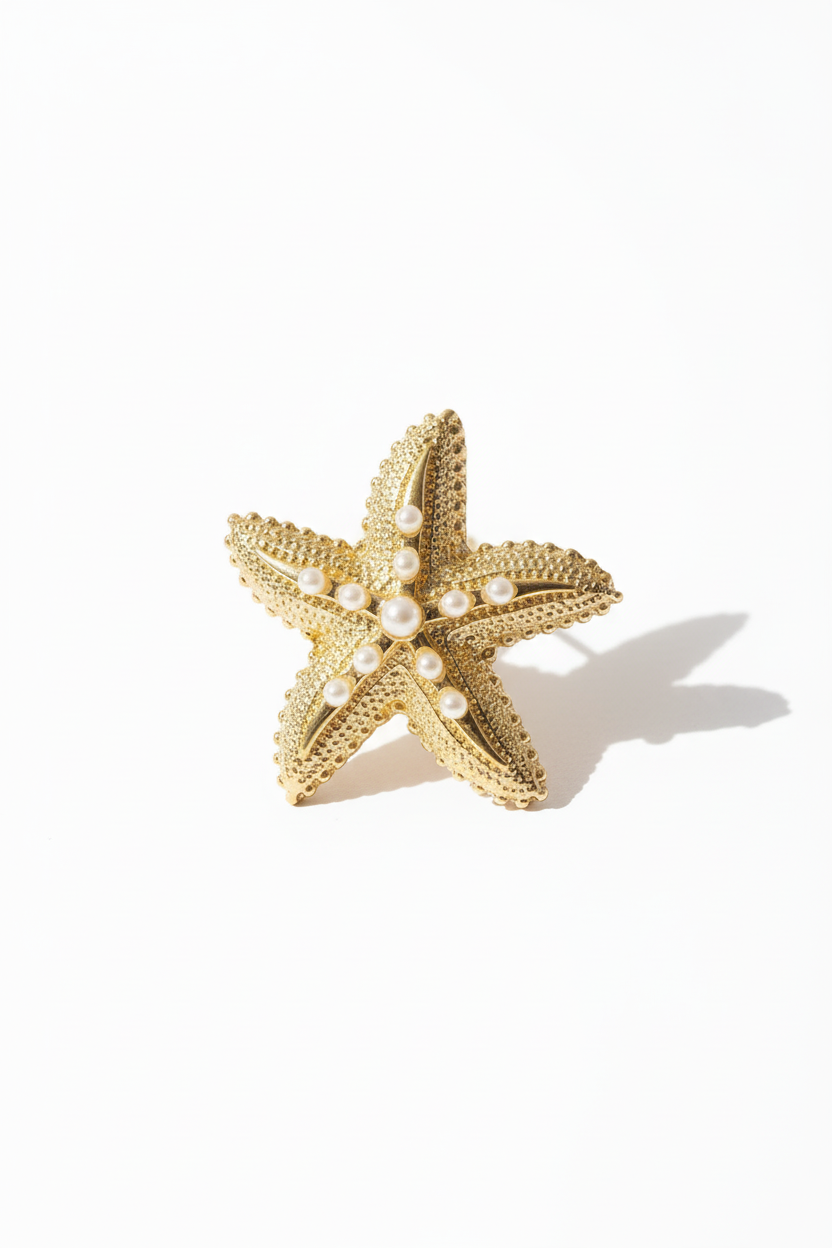 Boucles d'oreilles étoiles de mer détail fond blanc