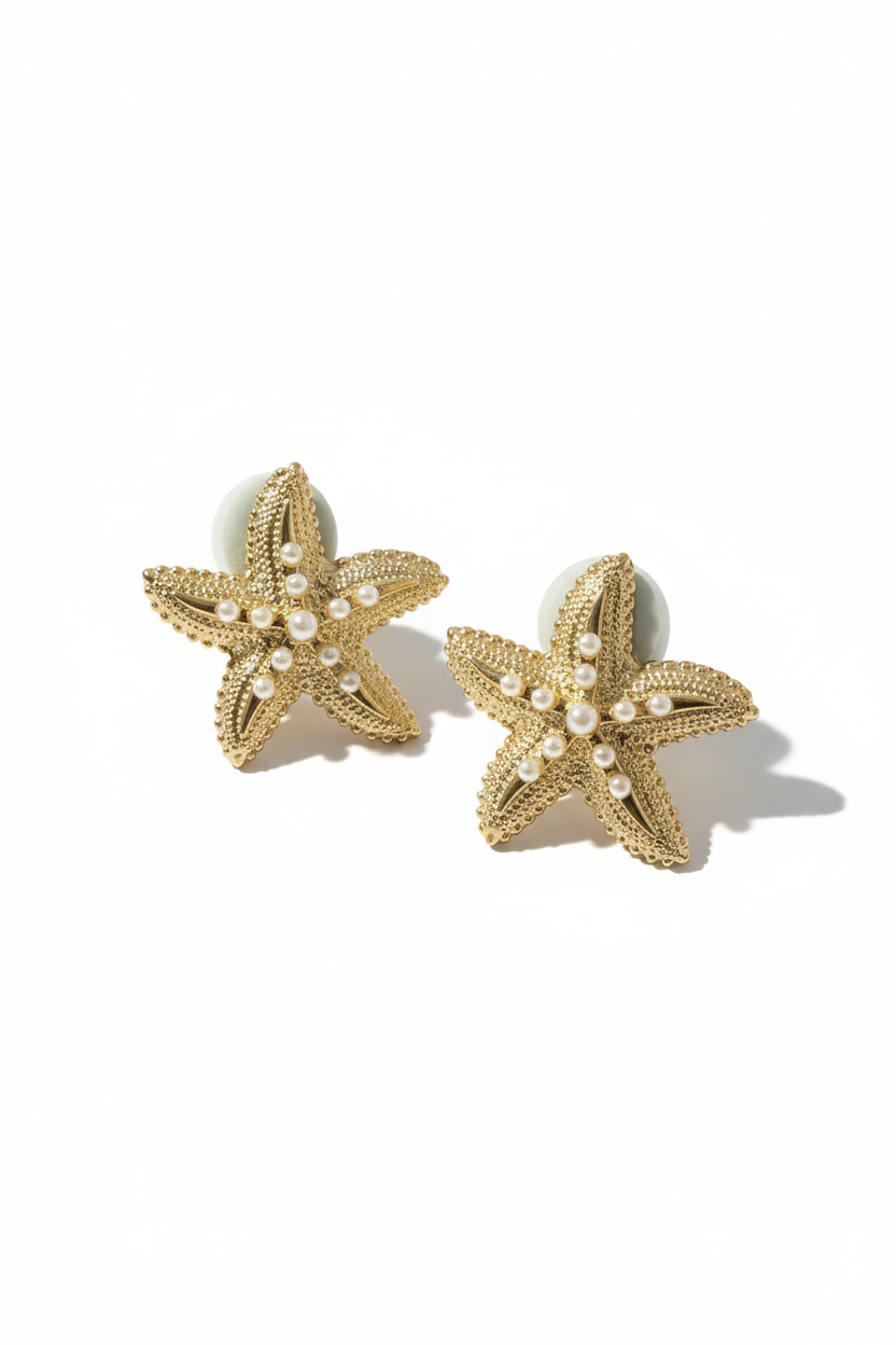 Boucles d'oreilles étoiles de mer paire fond blanc