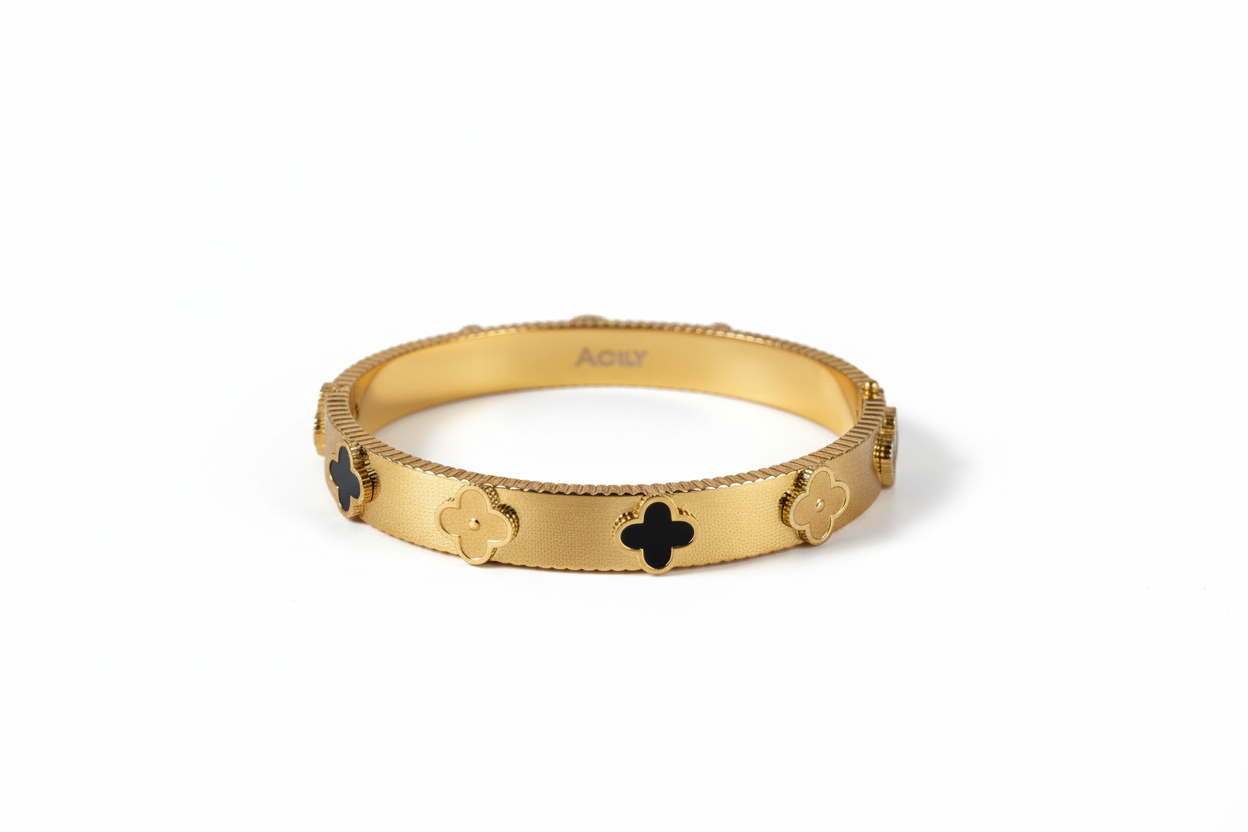 Bracelet Nerium trèfles dorés et noirs fond blanc latéral