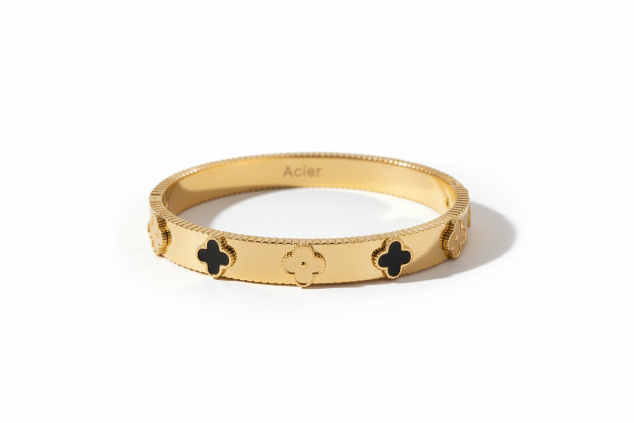 Bracelet Nerium trèfles dorés et noirs fond blanc